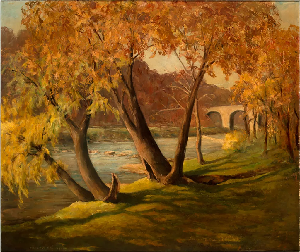 2014-1-15_Edwards_BrandywinePark-web An autumn landscape of trees and a calm river flowing diagonally where a bridge peeks through orange leaves, creating a leading line from the bottom-left to the top-right.